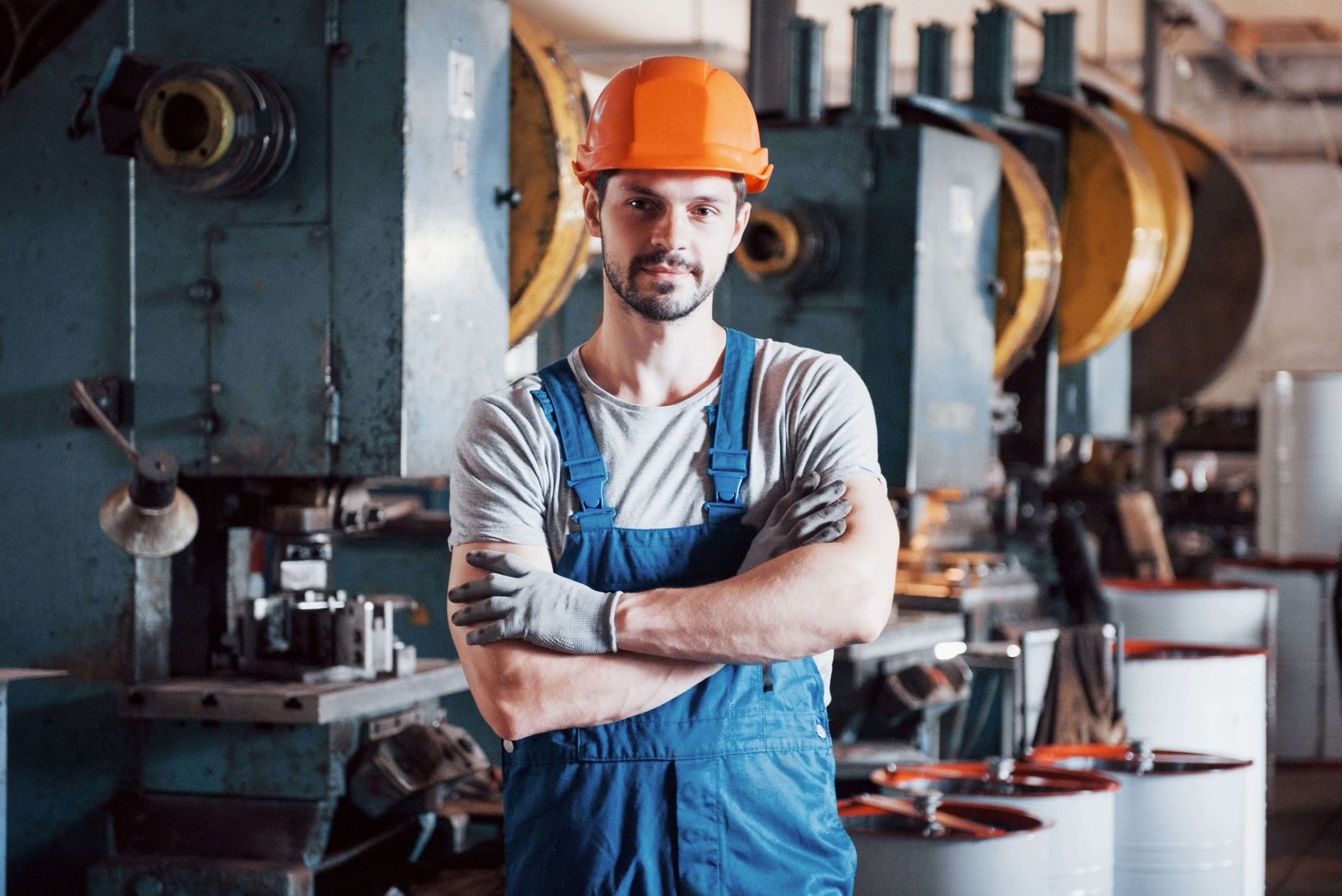 portrait young worker hard hat large metalworking plant 1 min scaled